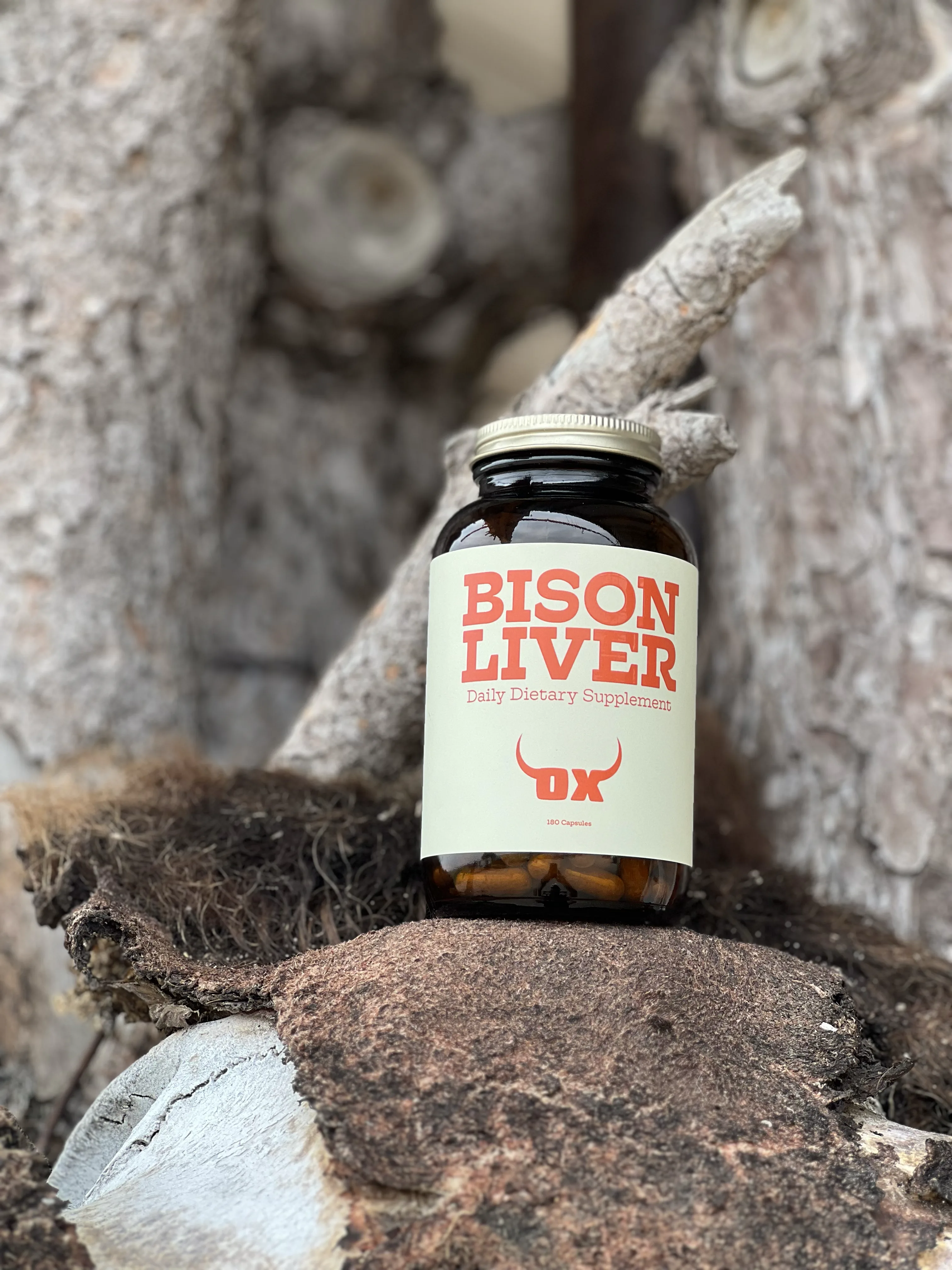 OX Bison Liver bottle displayed on weathered wood